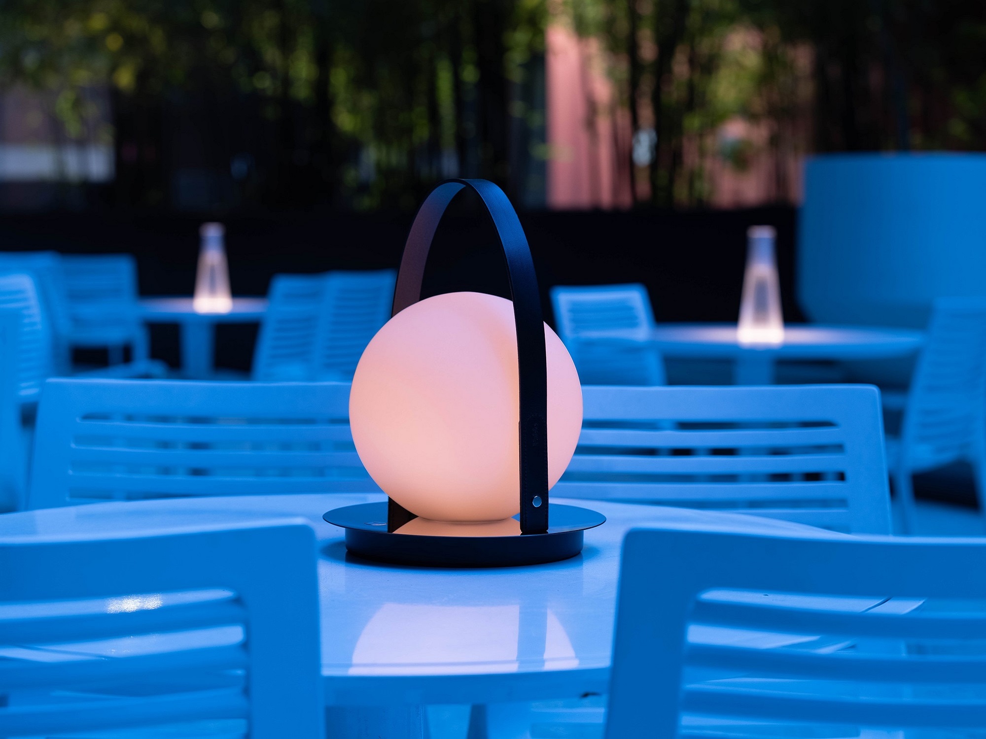 Round outdoor lamp on patio table